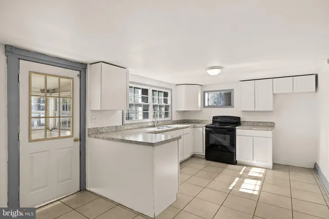 a kitchen with a sink and cabinets