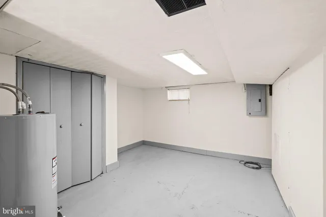 a bathroom with a tub and window