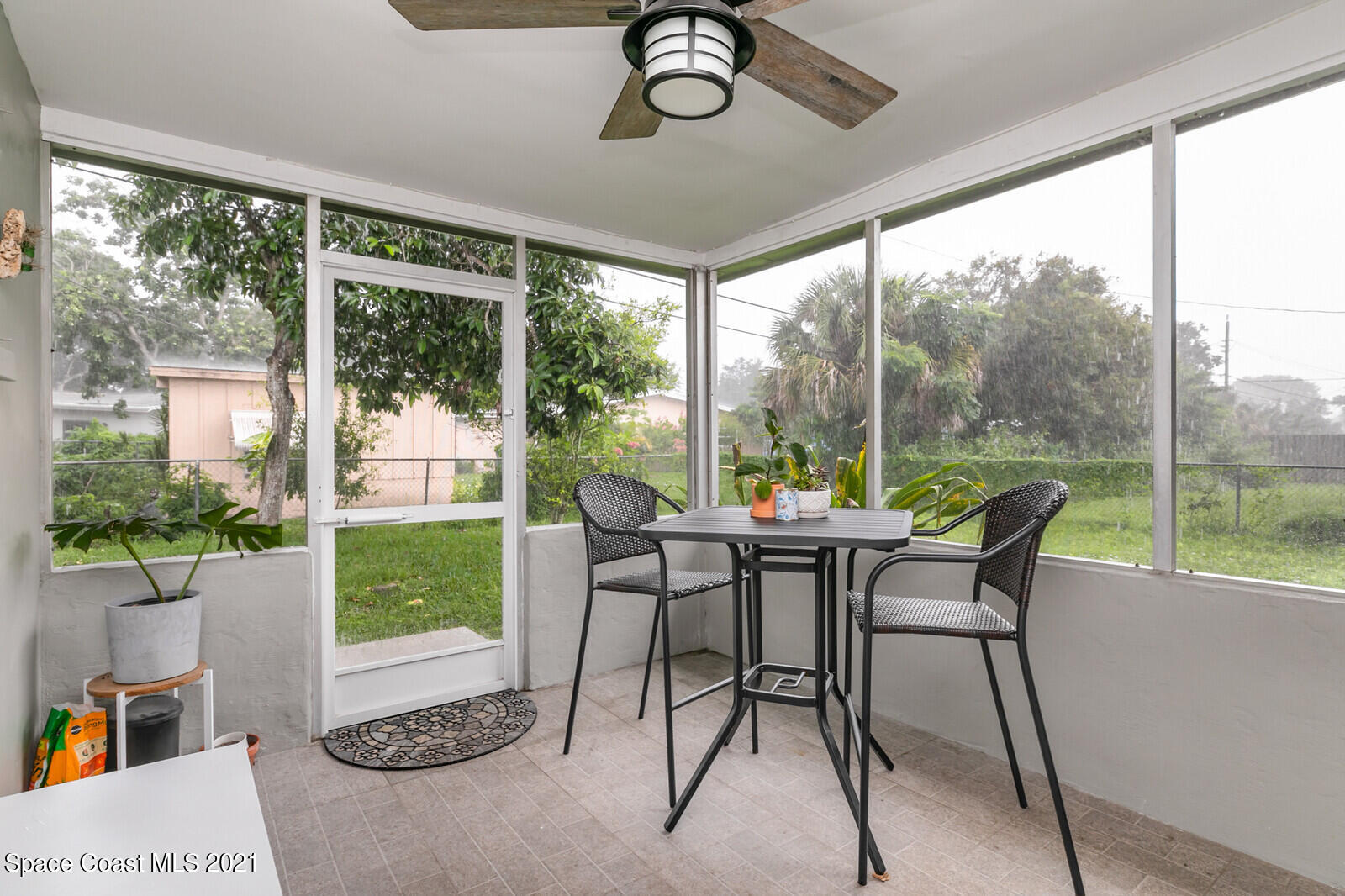 865 Osage Avenue Melbourne, FL 32935 - Photo 20 of 38 a view of a dining room with furniture window and outside view