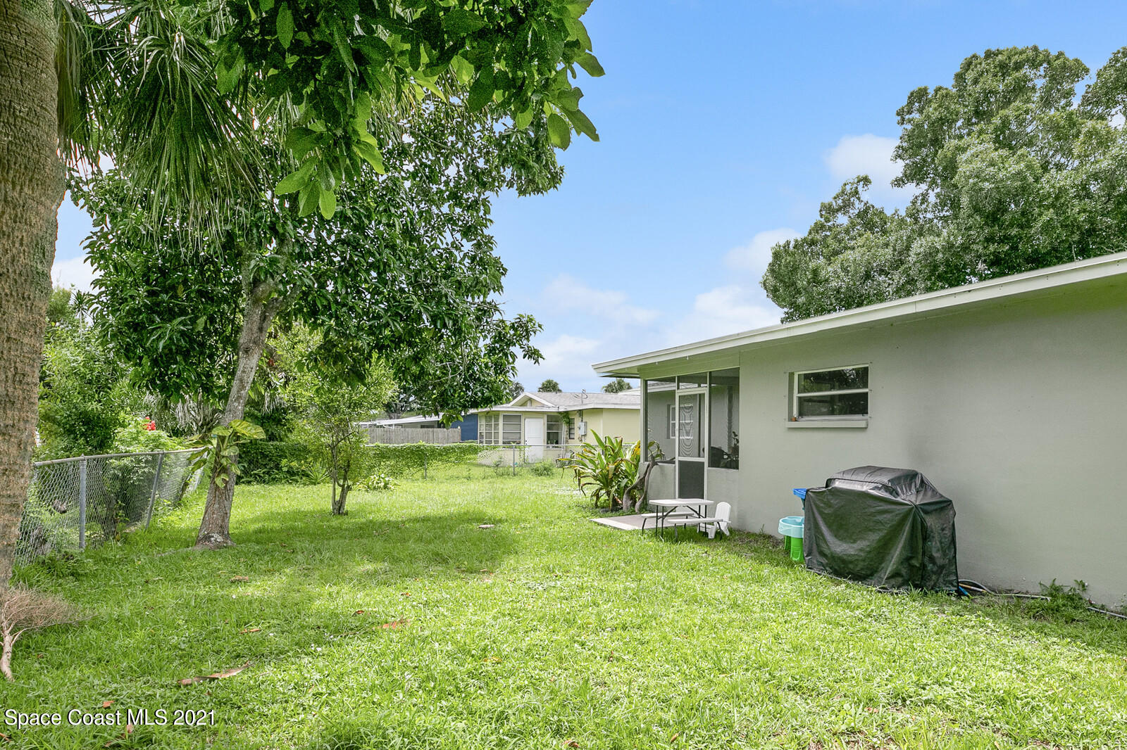 865 Osage Avenue Melbourne, FL 32935 - Photo 22 of 38 a view of outdoor space yard and deck