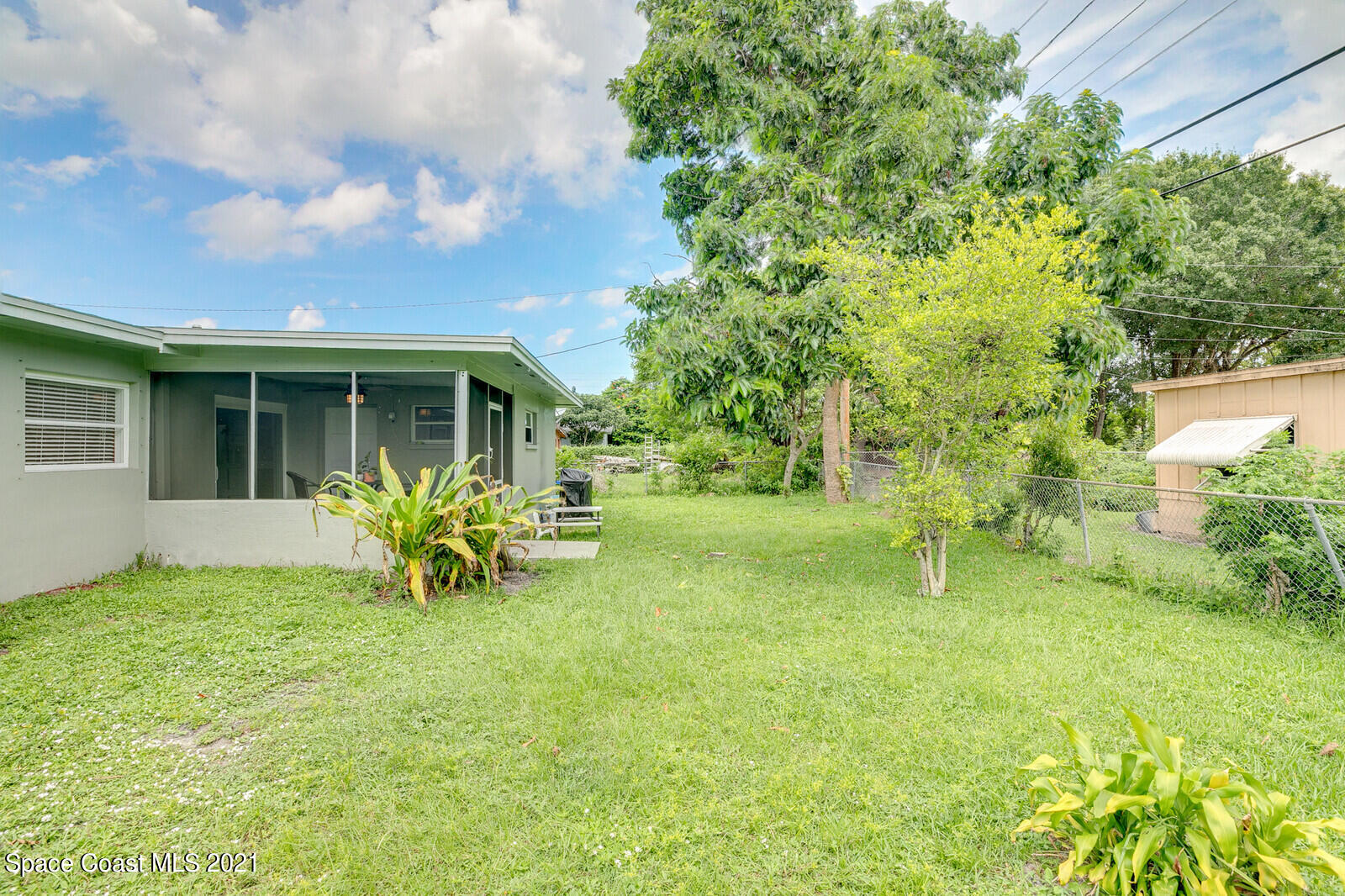 865 Osage Avenue Melbourne, FL 32935 - Photo 24 of 38 a view of a house with a yard