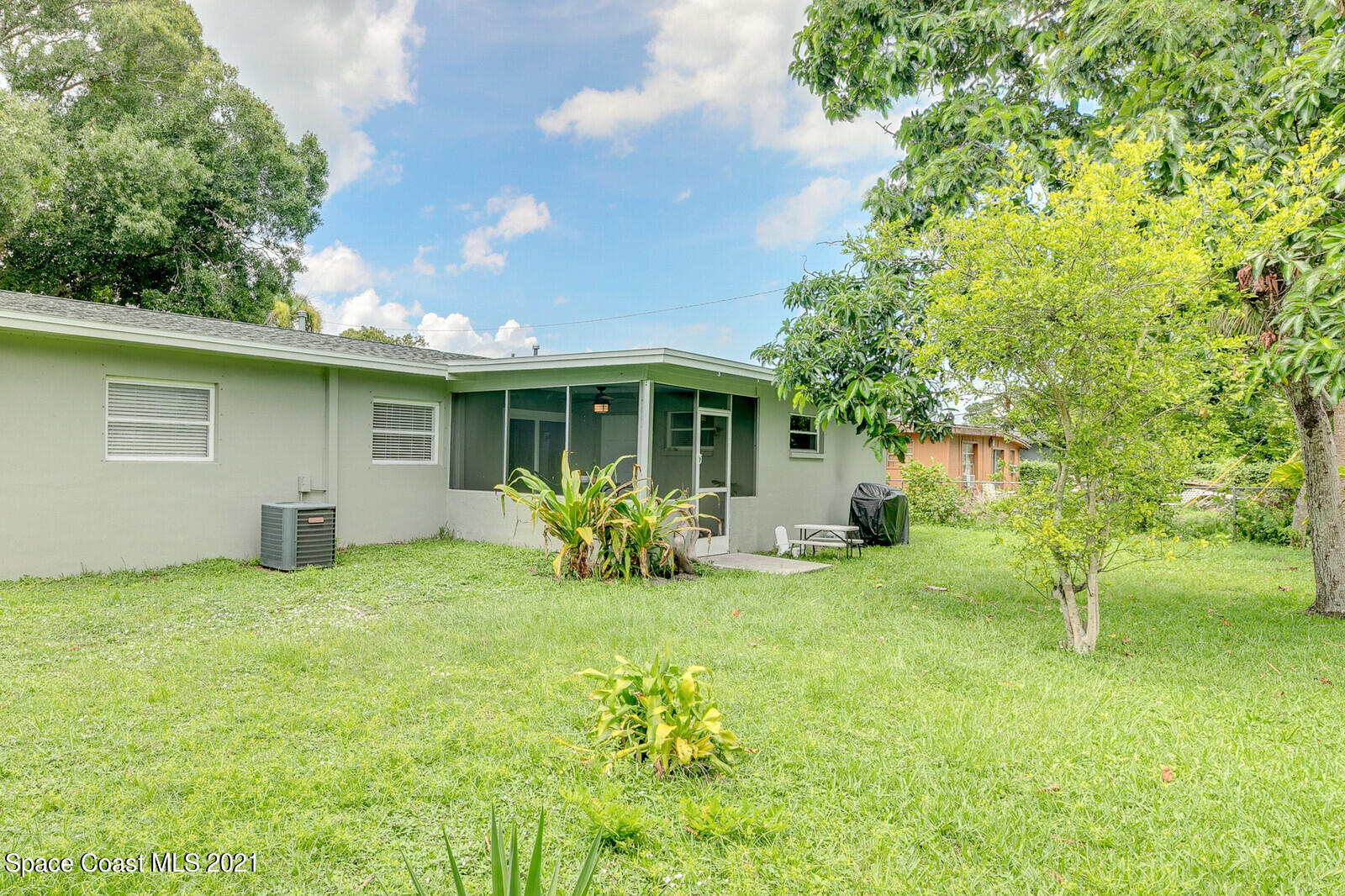 865 Osage Avenue Melbourne, FL 32935 - Photo 25 of 38 a view of a house with a yard