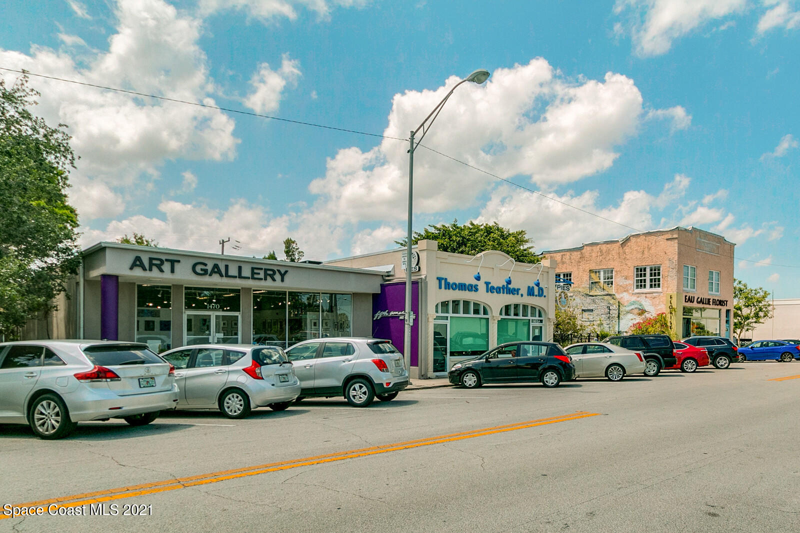 865 Osage Avenue Melbourne, FL 32935 - Photo 30 of 38 a cars parked in front of a building