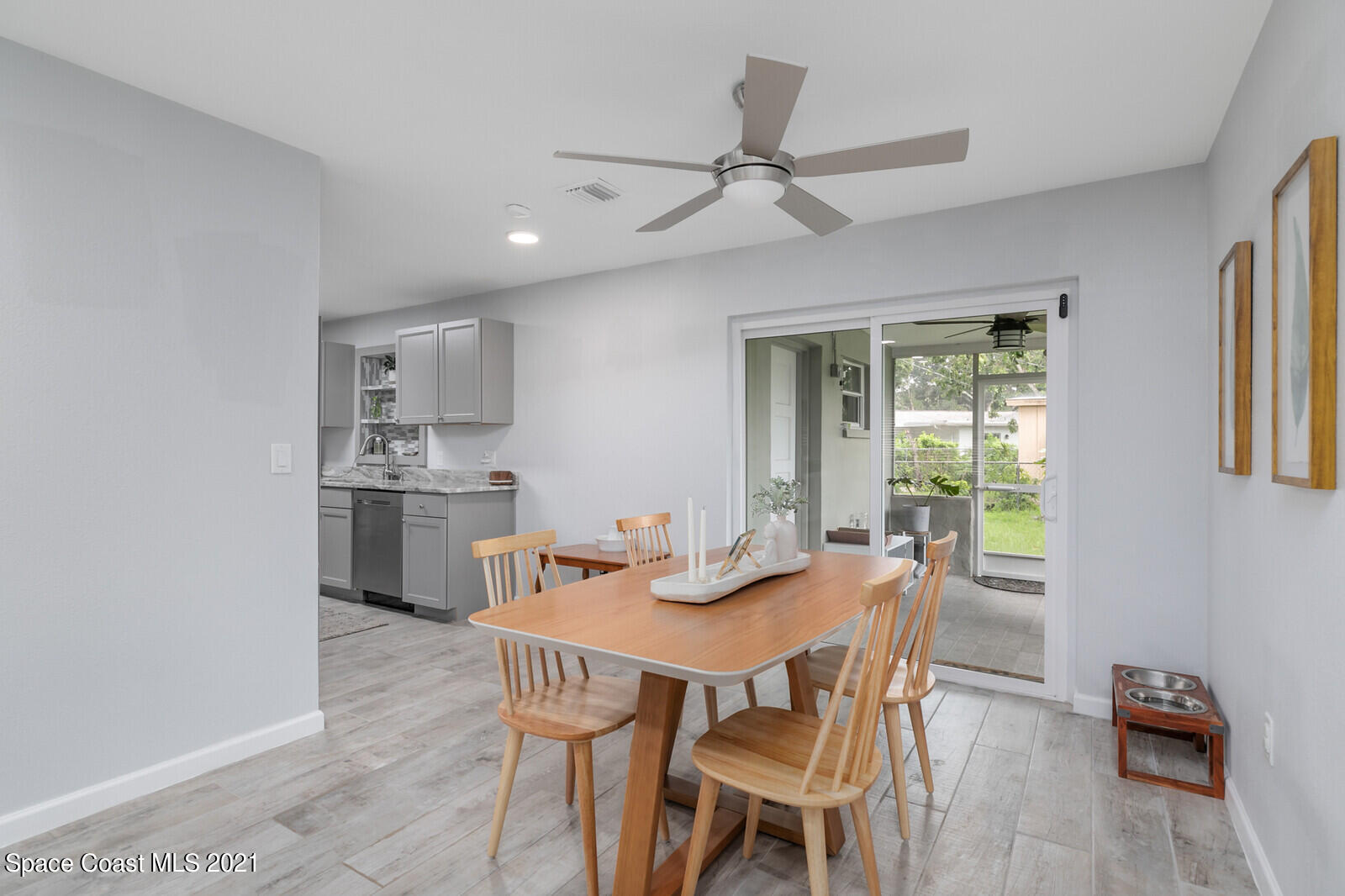 865 Osage Avenue Melbourne, FL 32935 - Photo 7 of 38 a view of a dining room with furniture window and wooden floor