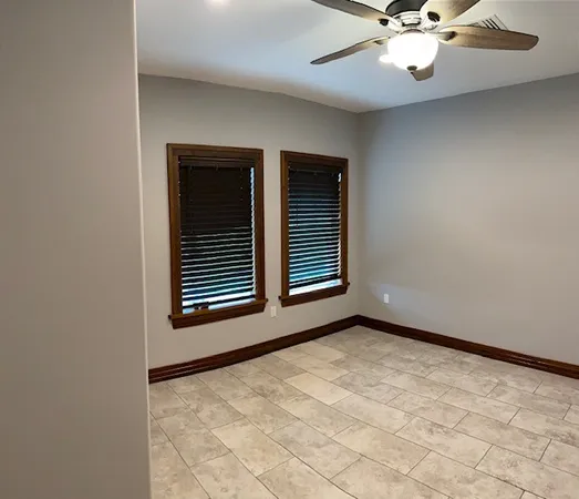 a view of an empty room with a window