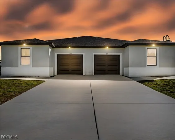 a front view of a house with a garage