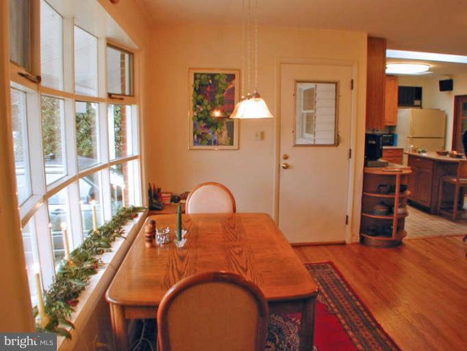 13105 Clifton Road Silver Spring, MD 20904 - Photo 11 of 30 Table space and bay window - door to carport