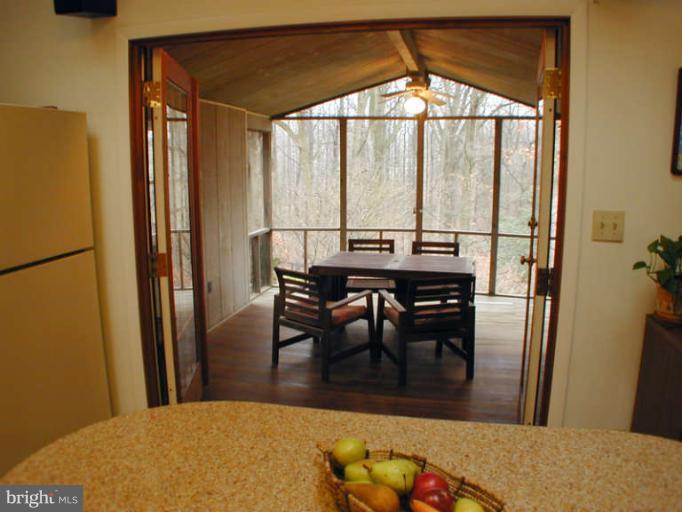 13105 Clifton Road Silver Spring, MD 20904 - Photo 12 of 30 Glass French doors lead to screened porch