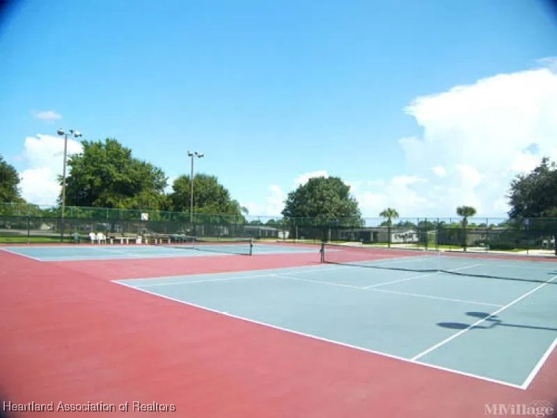 3312 Beartooth Pass Sebring, FL 33872 - Photo 36 of 39 a view of an outdoor space and tennis court