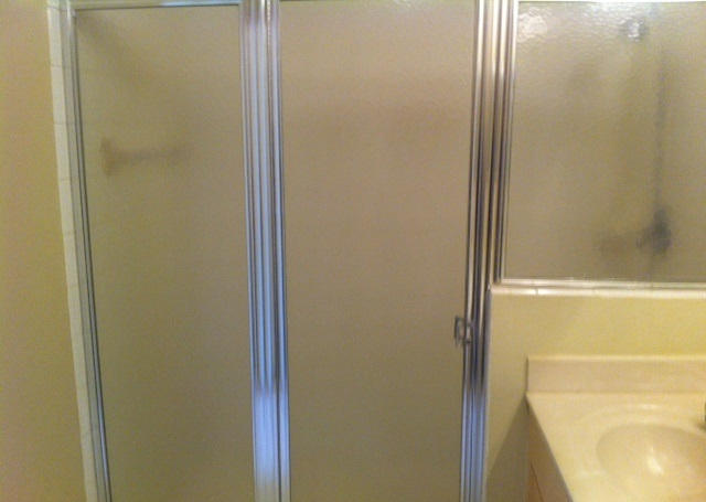 144 Coconut Key Lane Delray Beach, FL 33484 - Photo 16 of 16 a bathroom with a glass shower door