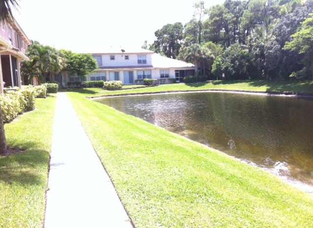 144 Coconut Key Lane Delray Beach, FL 33484 - Photo 3 of 16 a view of swimming pool with outdoor seating and yard