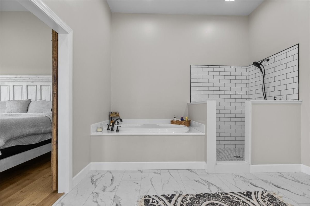 1489 Utley Road Camden, TN 38320 - Photo 20 of 60 a bathroom with a bathtub and a sink