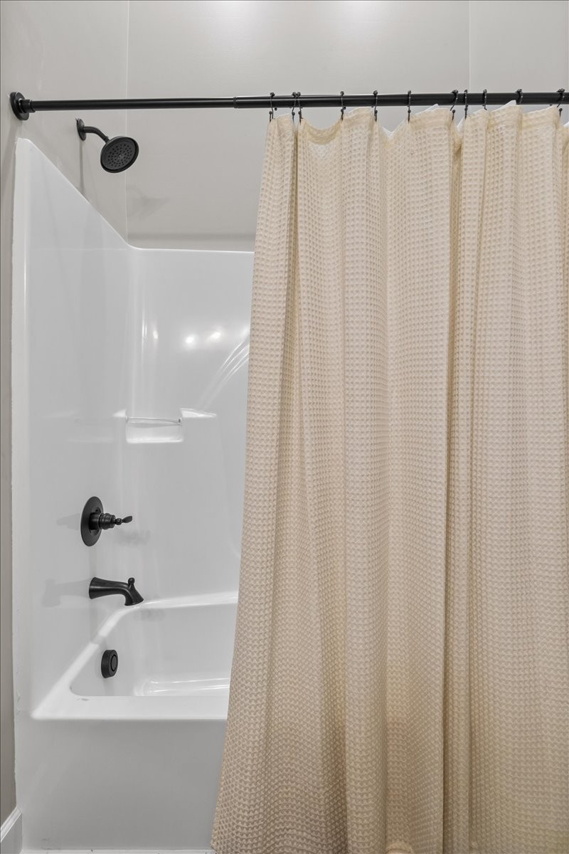 1489 Utley Road Camden, TN 38320 - Photo 27 of 60 a bathroom with a shower and a sink