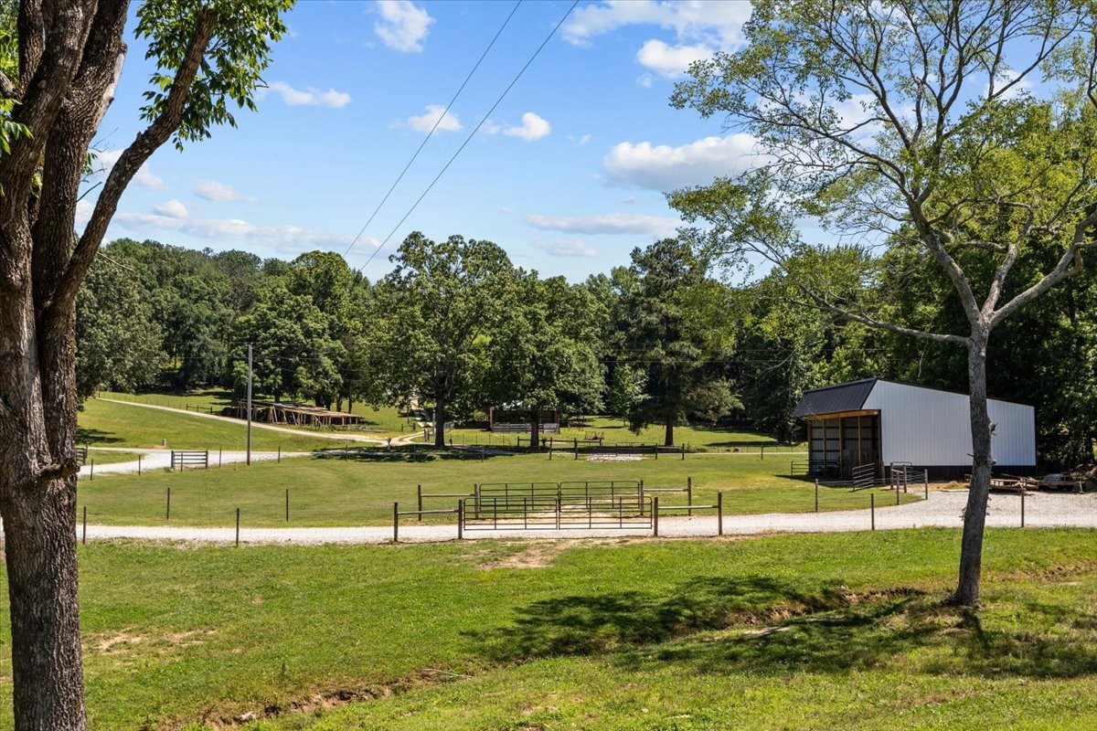 1489 Utley Road Camden, TN 38320 - Photo 48 of 60 a view of a golf course with a lake