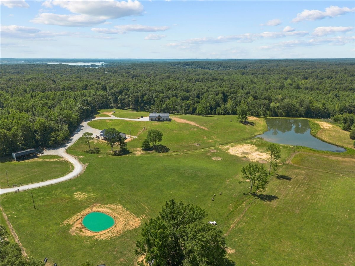 1489 Utley Road Camden, TN 38320 - Photo 56 of 60 a view of a lake with a yard