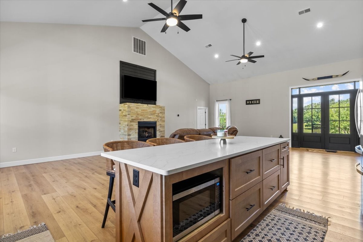 1489 Utley Road Camden, TN 38320 - Photo 7 of 60 a view of kitchen with kitchen island a stove a sink dishwasher and wooden floor