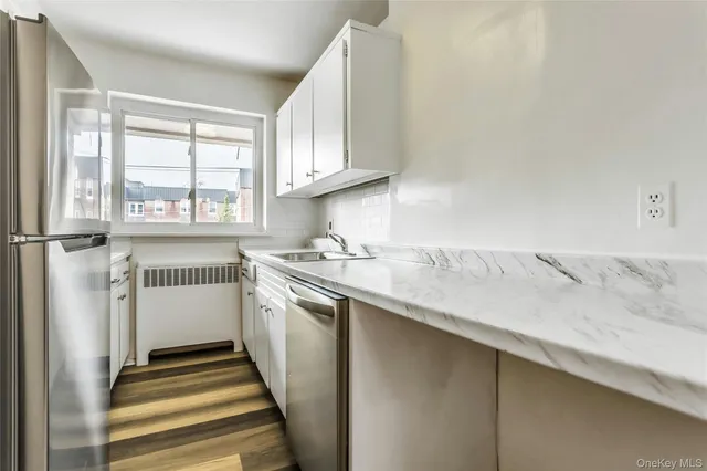 a kitchen with a sink and a window