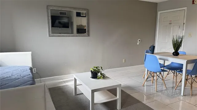 a living room with furniture and a table