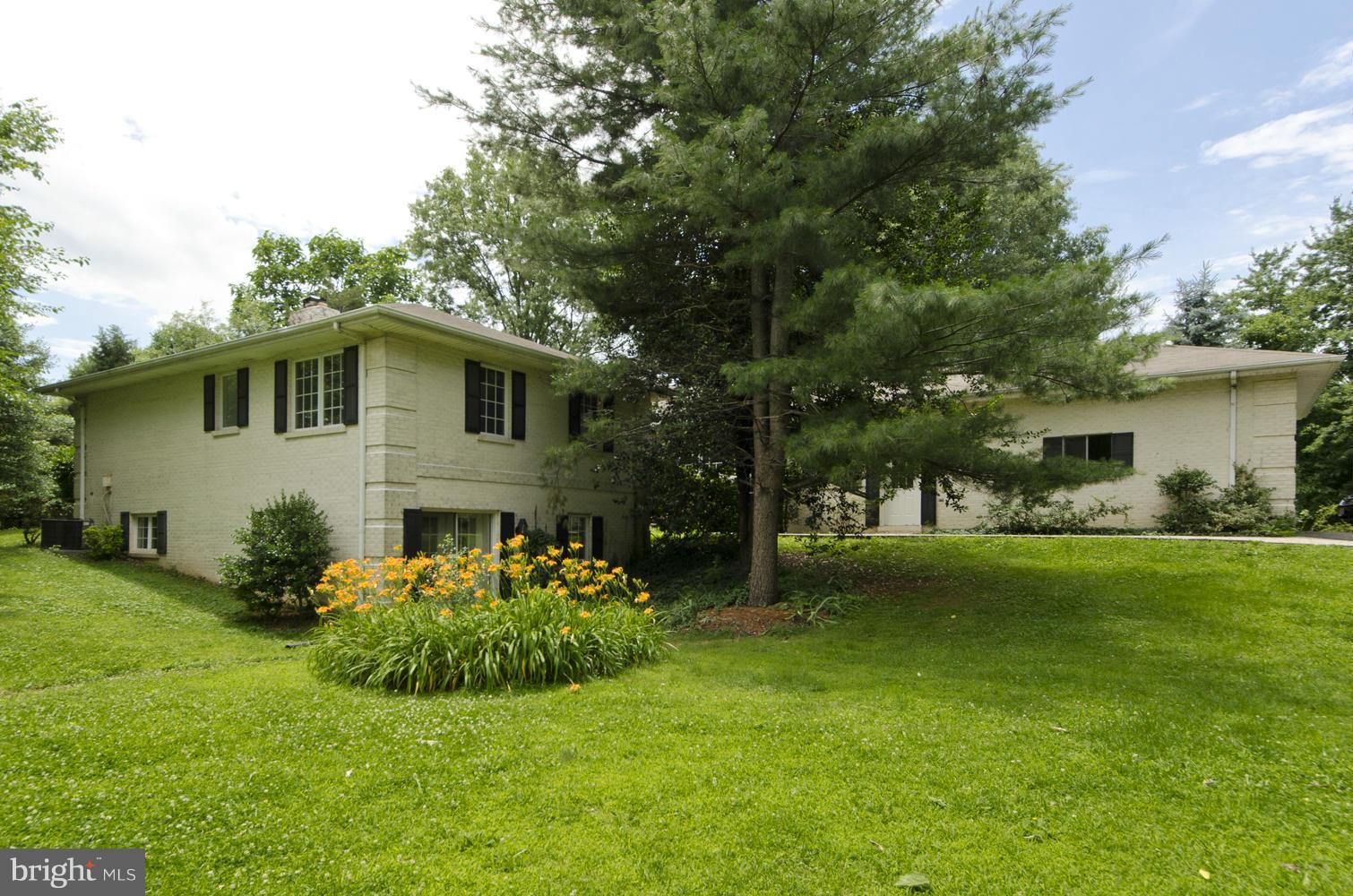 7120 Georgetown Pike McLean, VA 22101 - Photo 2 of 30 a front view of house with yard and green space