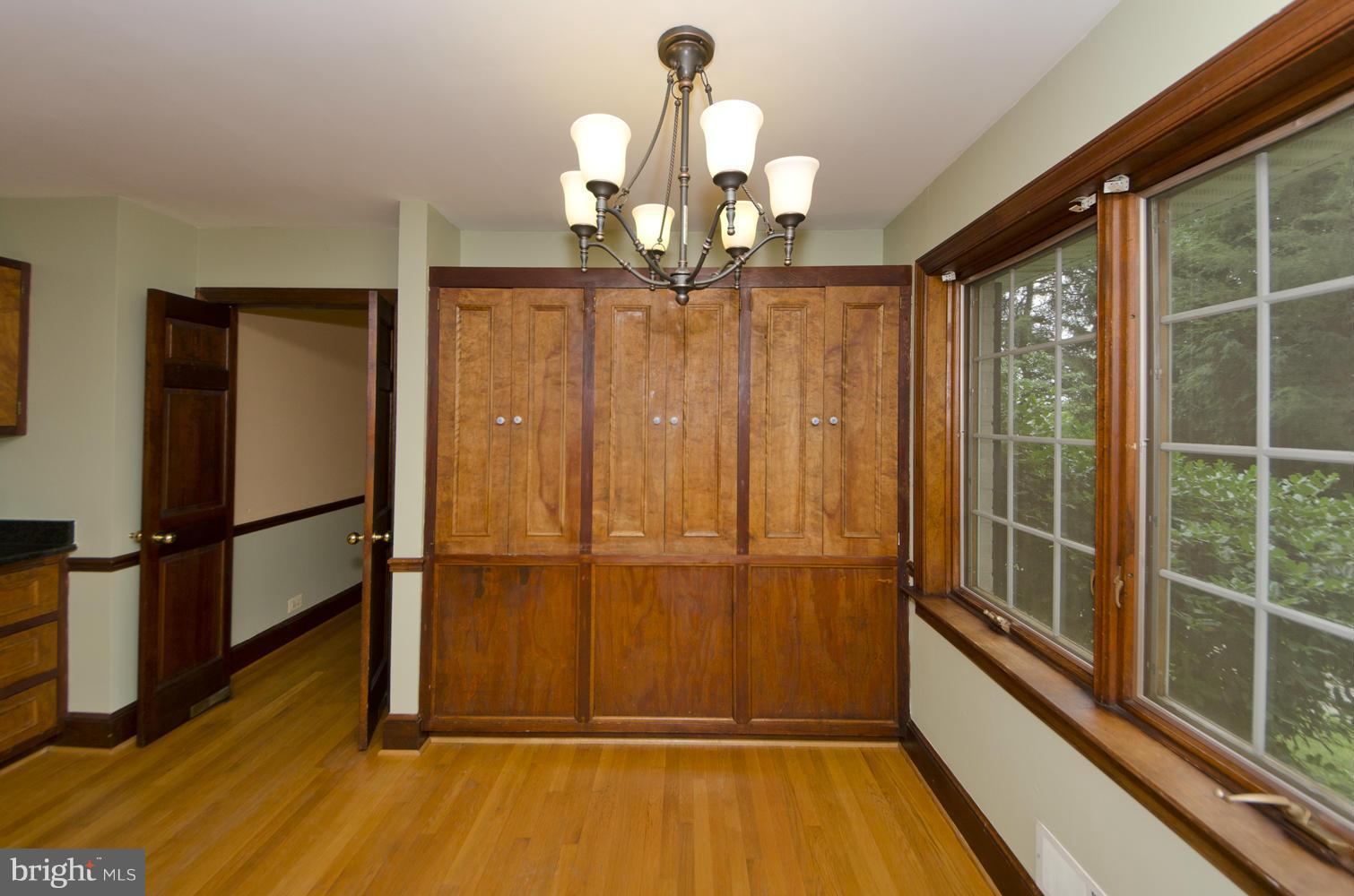 7120 Georgetown Pike McLean, VA 22101 - Photo 11 of 30 a view of a room with wooden floor fan and windows