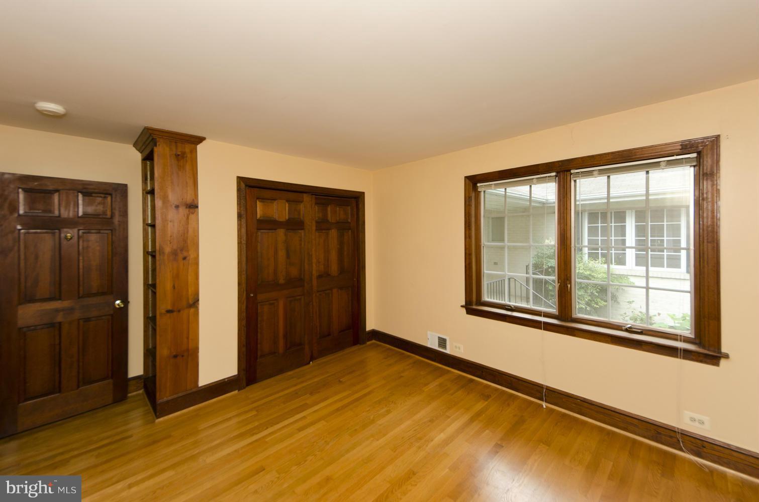 7120 Georgetown Pike McLean, VA 22101 - Photo 15 of 30 a view of an empty room with glass door and a window