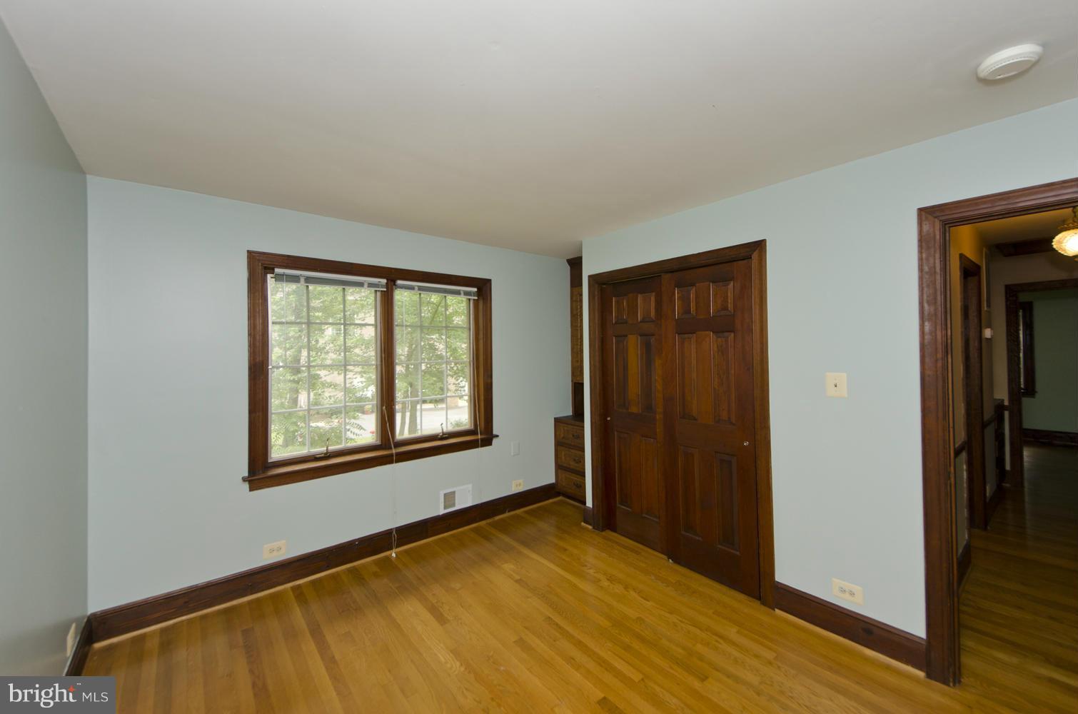 7120 Georgetown Pike McLean, VA 22101 - Photo 16 of 30 a view of an empty room with wooden floor and a window