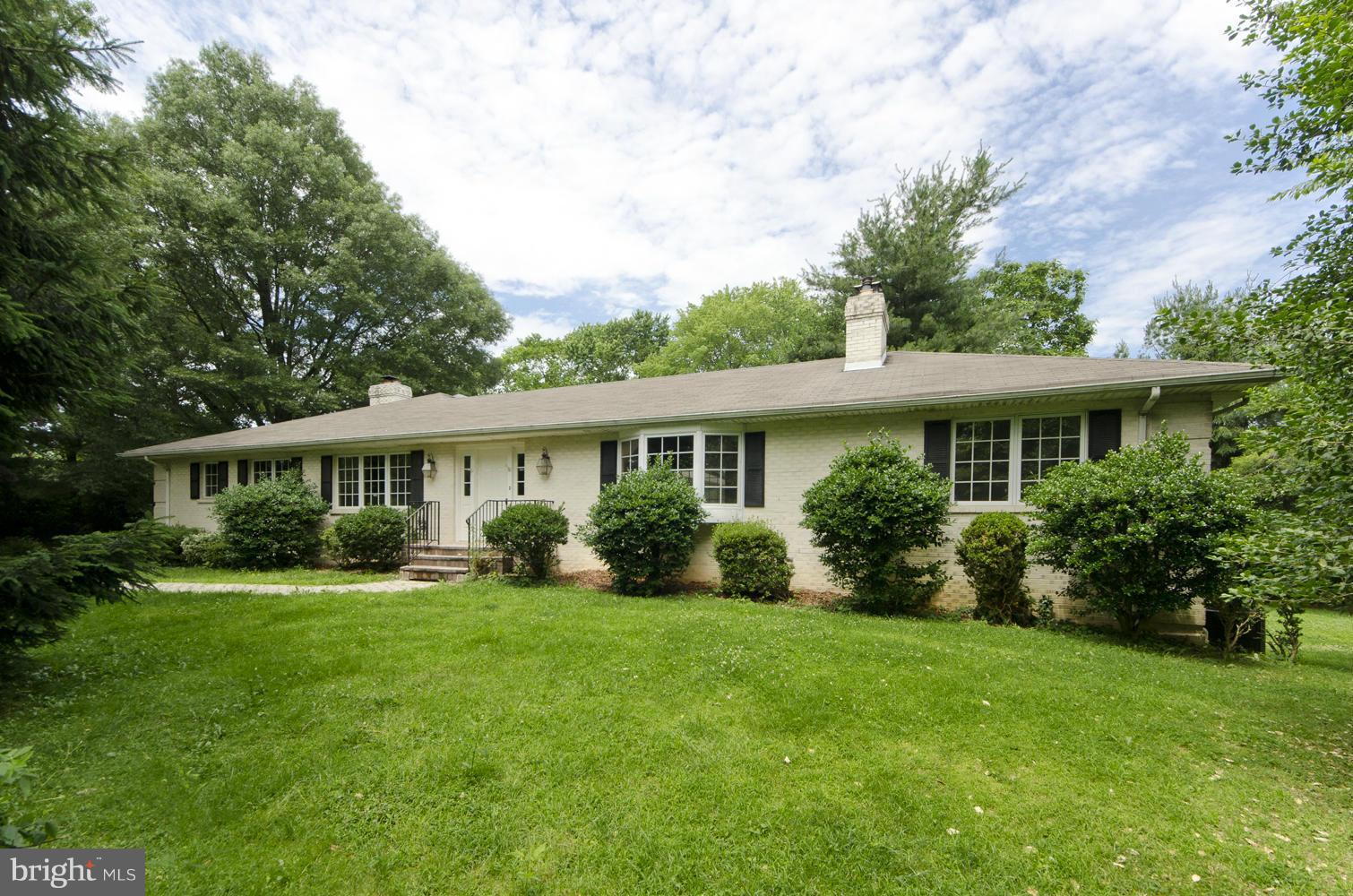 7120 Georgetown Pike McLean, VA 22101 - Photo 18 of 30 a view of a house with a yard and potted plants