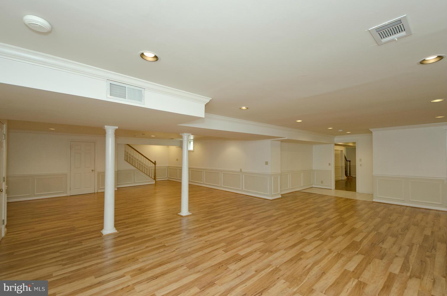 7120 Georgetown Pike McLean, VA 22101 - Photo 20 of 30 an empty room with wooden floor and window
