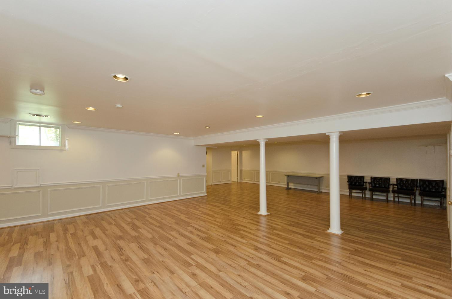 7120 Georgetown Pike McLean, VA 22101 - Photo 21 of 30 an empty room with wooden floor and windows