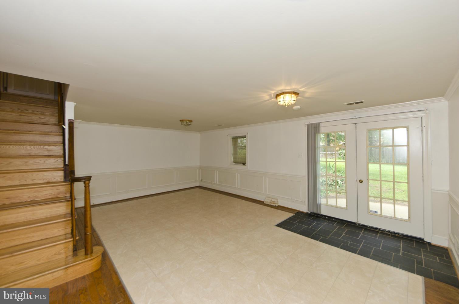 7120 Georgetown Pike McLean, VA 22101 - Photo 22 of 30 a view of a livingroom with an empty space and a window