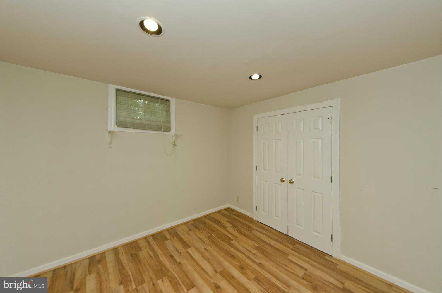 7120 Georgetown Pike McLean, VA 22101 - Photo 25 of 30 a view of room with wooden floor and fan
