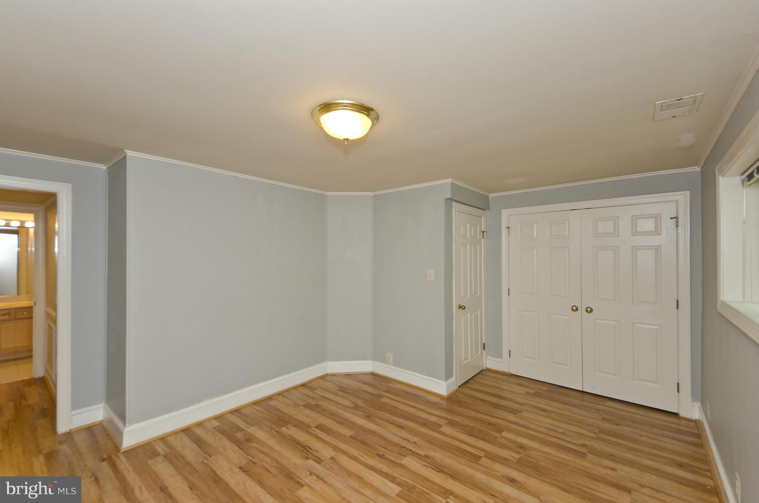 7120 Georgetown Pike McLean, VA 22101 - Photo 26 of 30 a view of empty room with wooden floor and fan