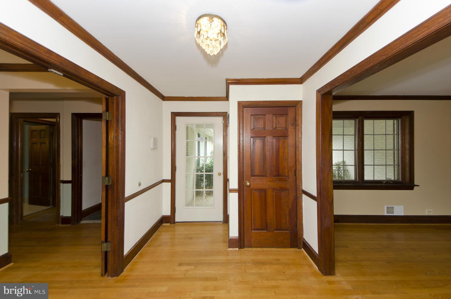 7120 Georgetown Pike McLean, VA 22101 - Photo 4 of 30 a view of a hallway with wooden floor and a livingroom