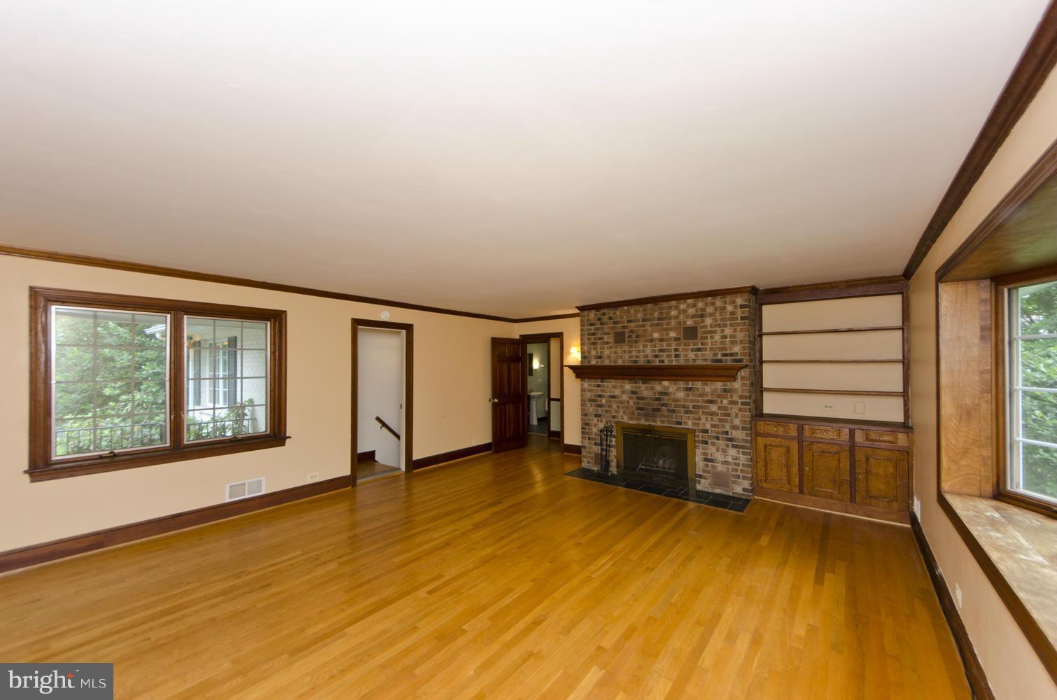 7120 Georgetown Pike McLean, VA 22101 - Photo 6 of 30 wooden floor in an empty room with a fireplace