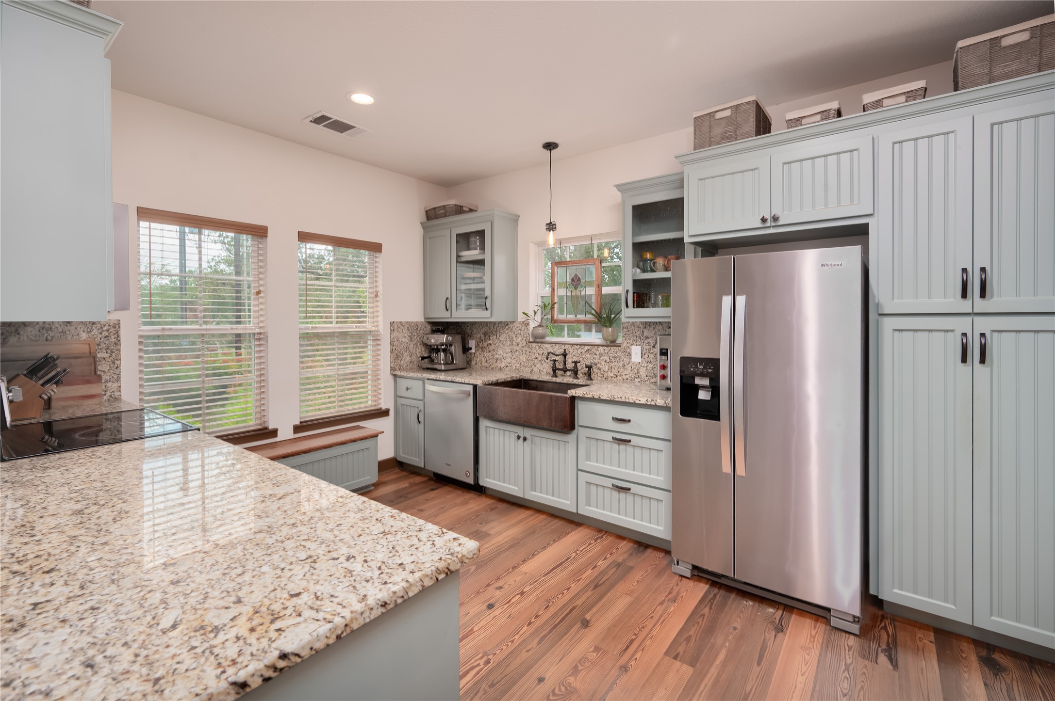 270 Dry Creek Road Manor, TX 78653 - Photo 11 of 40 A well-appointed kitchen showcasing elegant wooden floors and plentiful cabinetry.