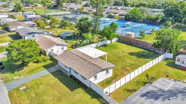 an aerial view of a house with a swimming pool