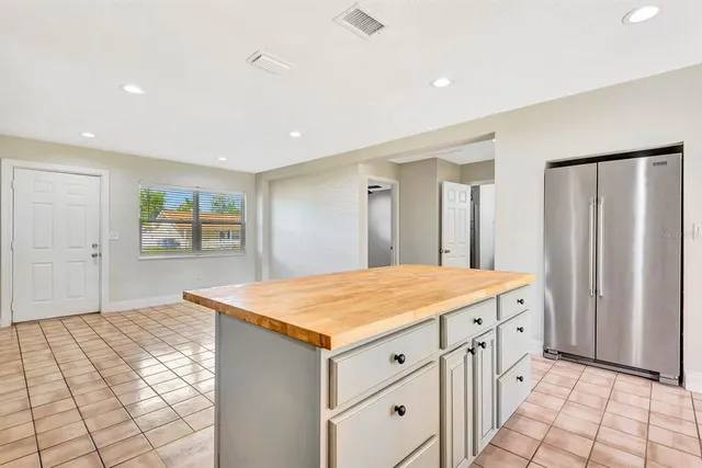 a room with a dresser and mirror