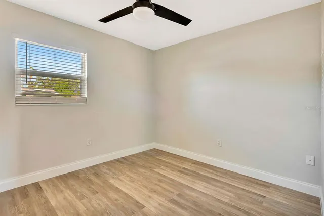 an empty room with a empty space and a window