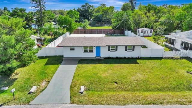 a aerial view of a house with swimming pool