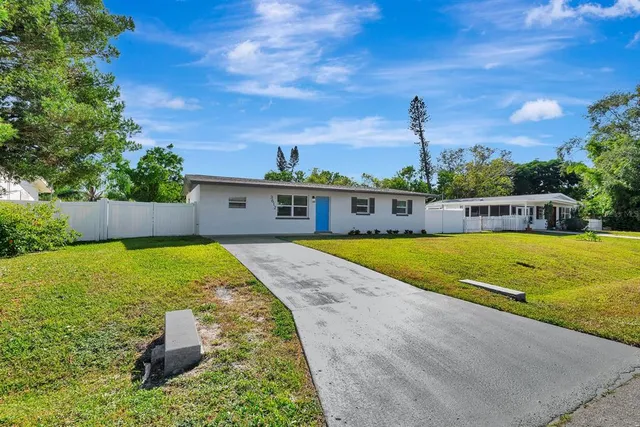 a view of swimming pool with a backyard
