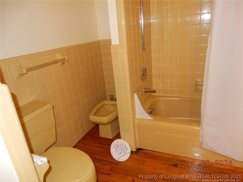 708 Rush Road Fayetteville, NC 28305 - Photo 15 of 17 a bathroom with a granite countertop sink mirror vanity and toilet