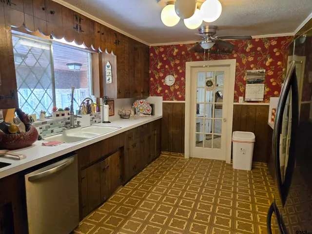 a bathroom with a sink a toilet a mirror and shower
