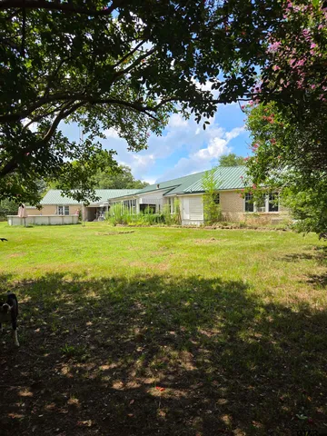 a view of a building with a big yard
