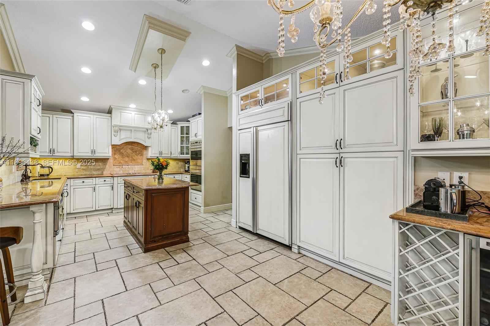 10101 Southwest 5th Street Plantation, FL 33324 - Photo 18 of 77 a kitchen with stainless steel appliances granite countertop a refrigerator and a stove top oven