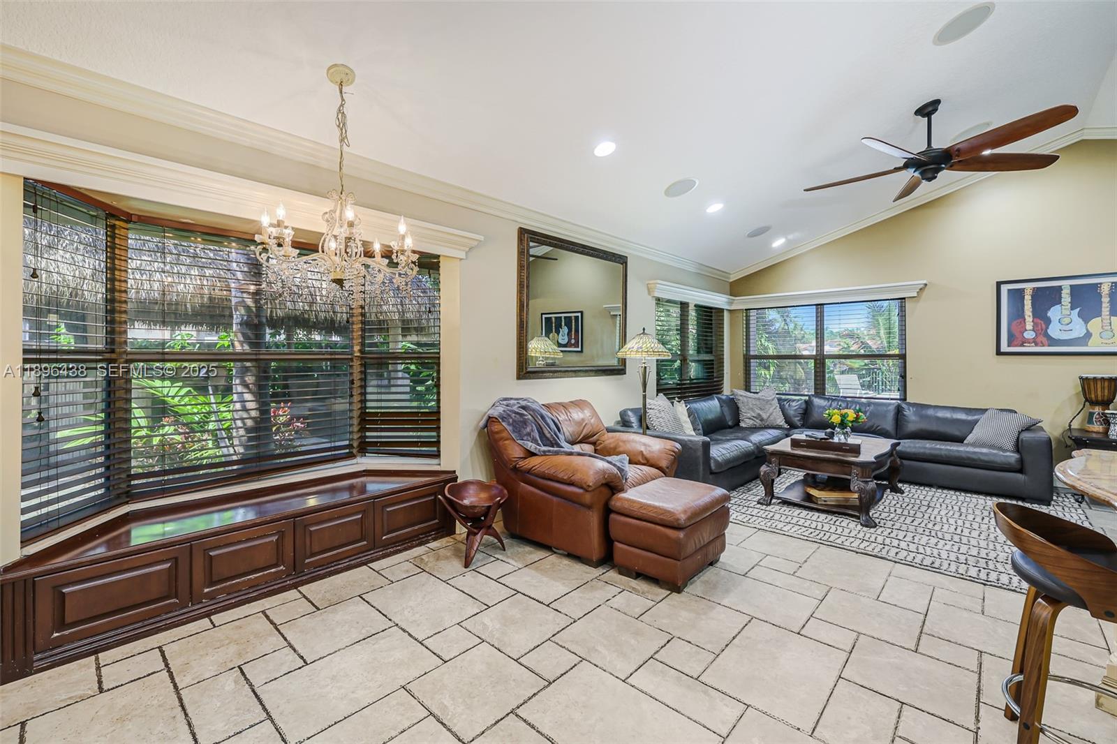 10101 Southwest 5th Street Plantation, FL 33324 - Photo 21 of 77 a living room with furniture and chandelier