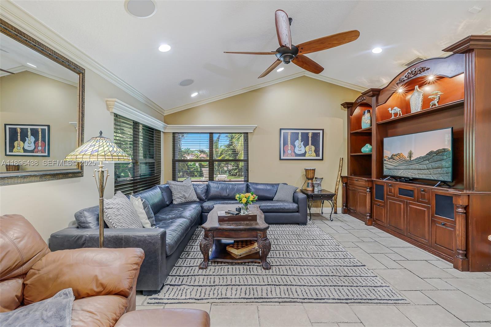 10101 Southwest 5th Street Plantation, FL 33324 - Photo 22 of 77 a living room with furniture and a flat screen tv