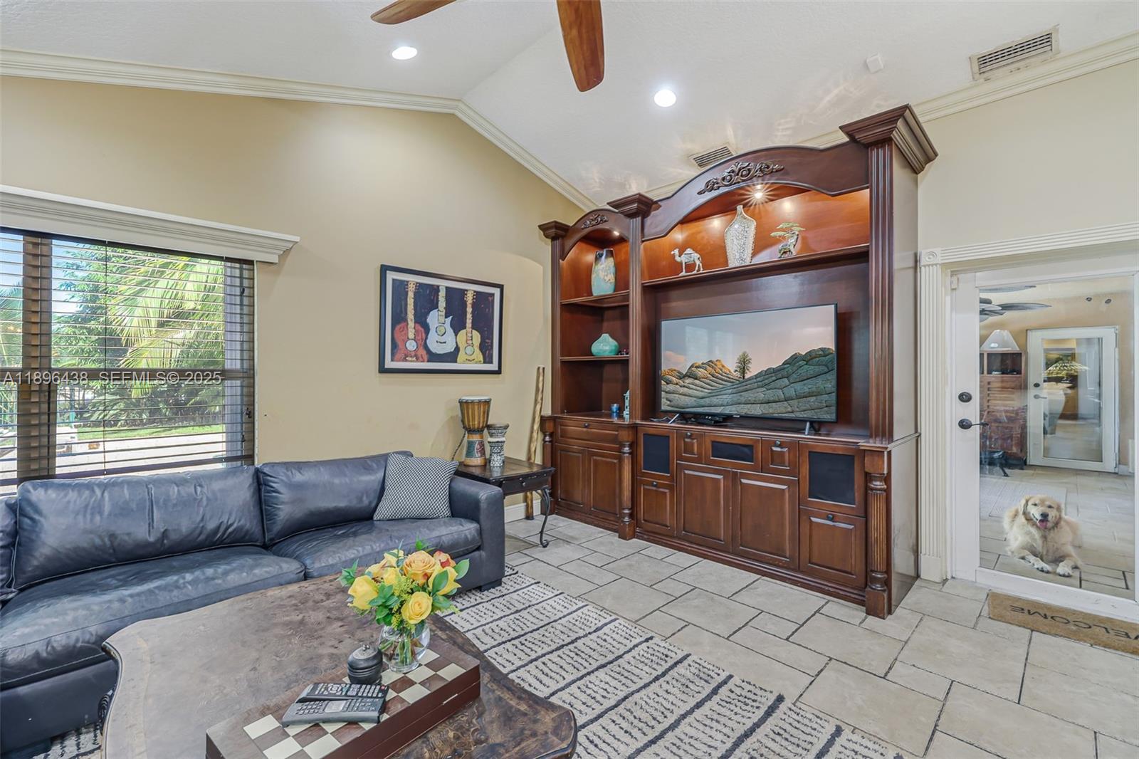 10101 Southwest 5th Street Plantation, FL 33324 - Photo 23 of 77 a living room with furniture and a flat screen tv