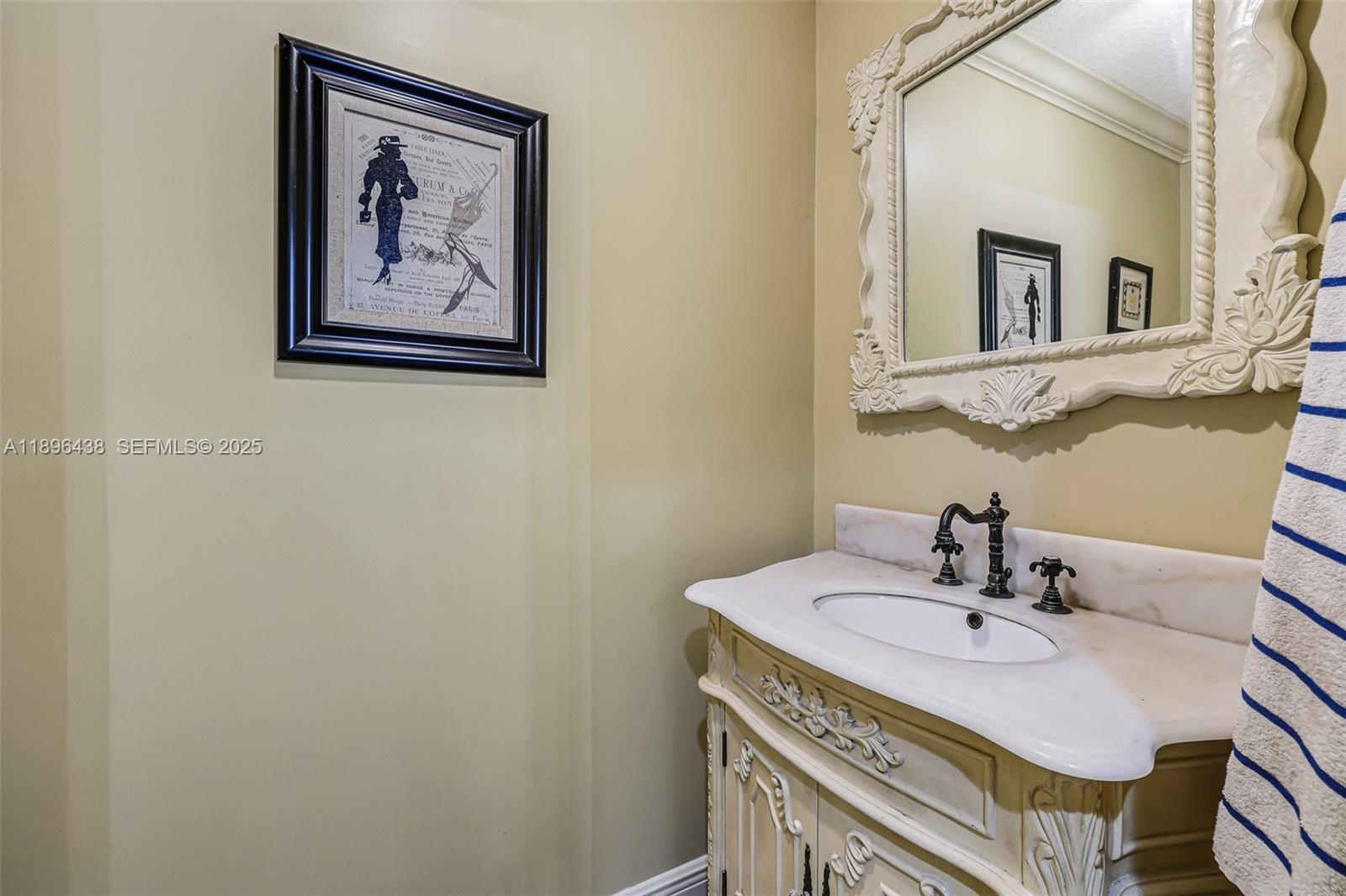 10101 Southwest 5th Street Plantation, FL 33324 - Photo 27 of 77 a bathroom with a sink and a mirror