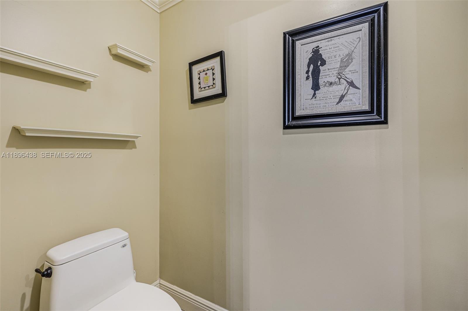 10101 Southwest 5th Street Plantation, FL 33324 - Photo 28 of 77 a white toilet sitting next to a small bathroom