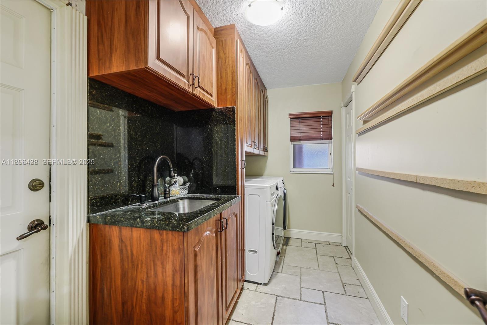 10101 Southwest 5th Street Plantation, FL 33324 - Photo 29 of 77 a kitchen with stainless steel appliances granite countertop a stove and a refrigerator